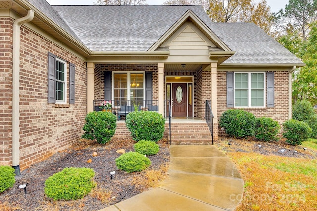 entrance to property featuring covered porch