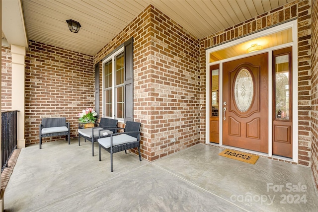 property entrance featuring covered porch