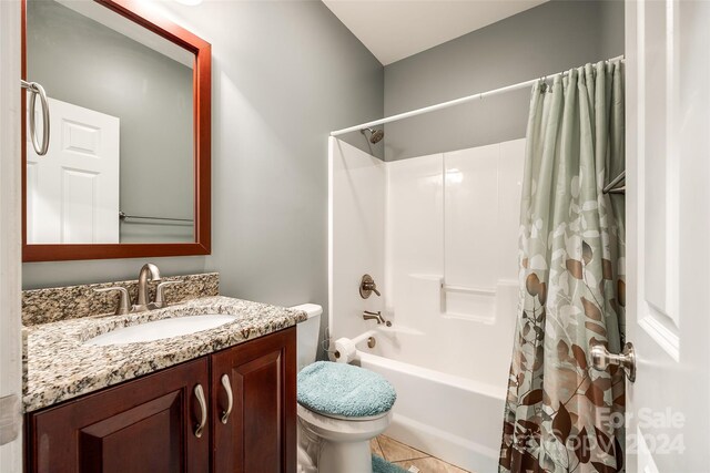 full bathroom with vanity, tile patterned floors, toilet, and shower / bathtub combination with curtain