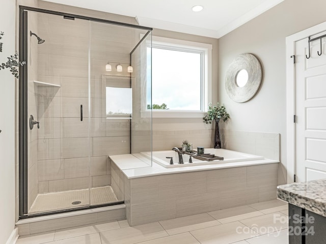 bathroom with plus walk in shower and crown molding