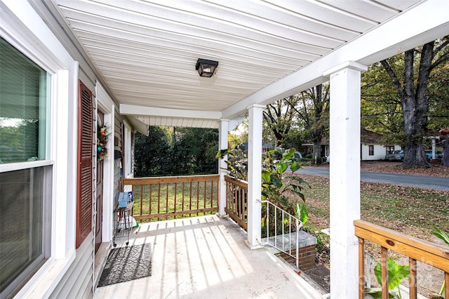 wooden terrace with a porch