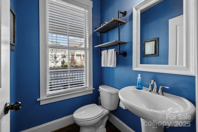 bathroom featuring sink and toilet