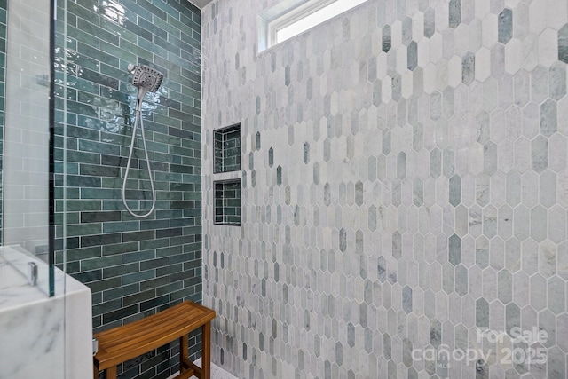 bathroom featuring tiled shower