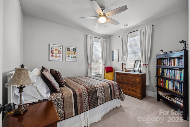 bedroom with light colored carpet and ceiling fan