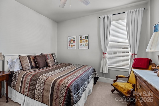 bedroom featuring light colored carpet and ceiling fan