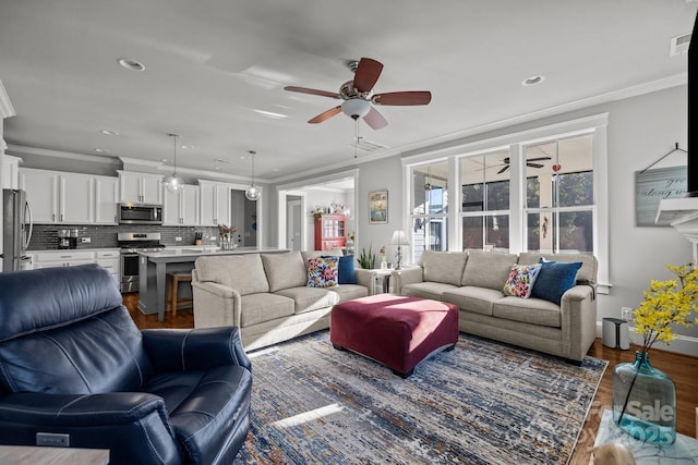 living room featuring crown molding, ceiling fan, and dark hardwood / wood-style flooring