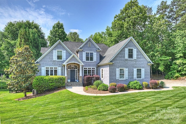 craftsman-style home with a front yard