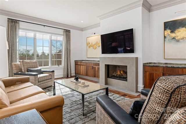 living room with ornamental molding and light hardwood / wood-style flooring