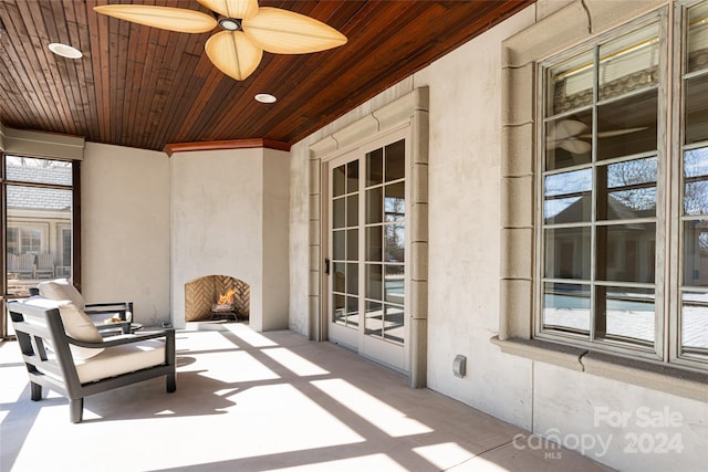 view of patio featuring ceiling fan