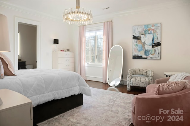 bedroom featuring a notable chandelier, dark hardwood / wood-style floors, and crown molding