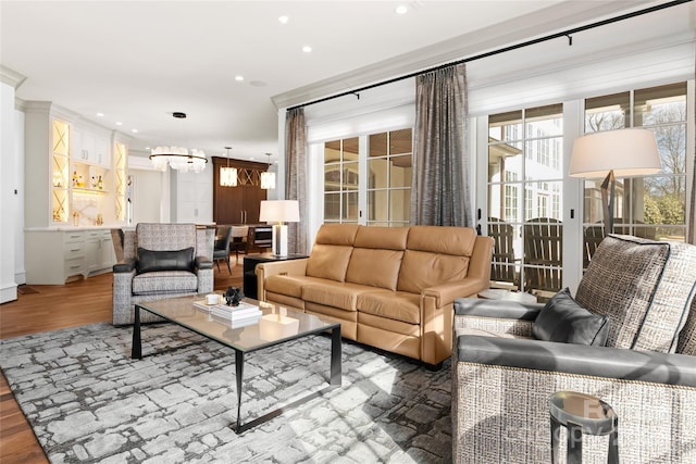 living room featuring hardwood / wood-style floors and a notable chandelier