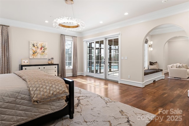 bedroom featuring access to outside, ornamental molding, and wood-type flooring