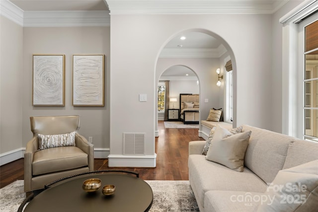 living room featuring crown molding and dark hardwood / wood-style flooring