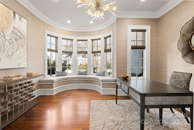 home office featuring a notable chandelier, ornamental molding, and hardwood / wood-style floors