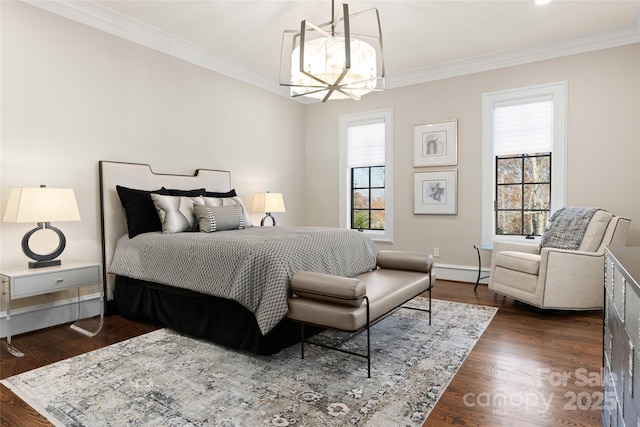 bedroom featuring a baseboard heating unit, crown molding, dark wood-type flooring, and a notable chandelier