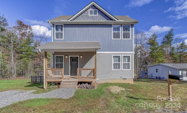 view of front of home featuring a front lawn and covered porch