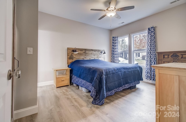 bedroom featuring light wood-type flooring and ceiling fan