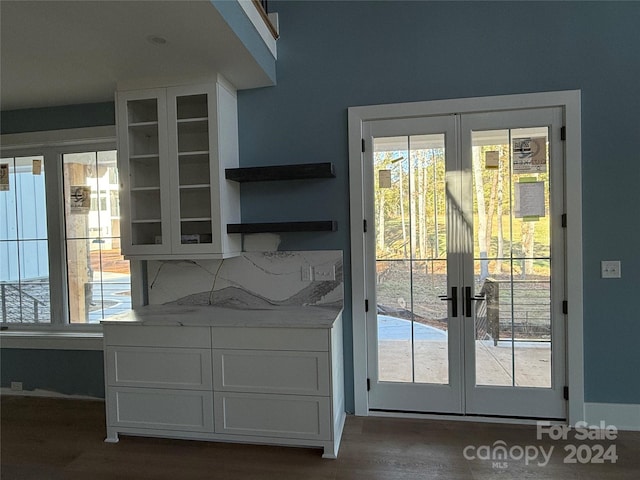 doorway featuring french doors, dark hardwood / wood-style flooring, and a healthy amount of sunlight