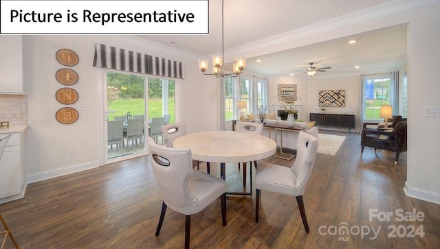 dining space with dark hardwood / wood-style flooring, a healthy amount of sunlight, and ceiling fan with notable chandelier