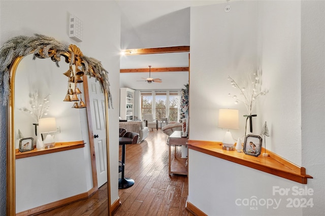 hallway featuring hardwood / wood-style flooring and beamed ceiling