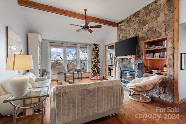 living room with a fireplace, wood-type flooring, lofted ceiling with beams, and ceiling fan