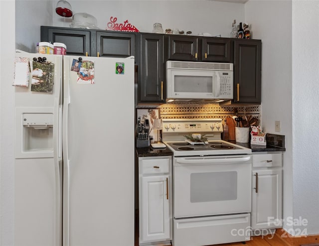 kitchen with white appliances and tasteful backsplash