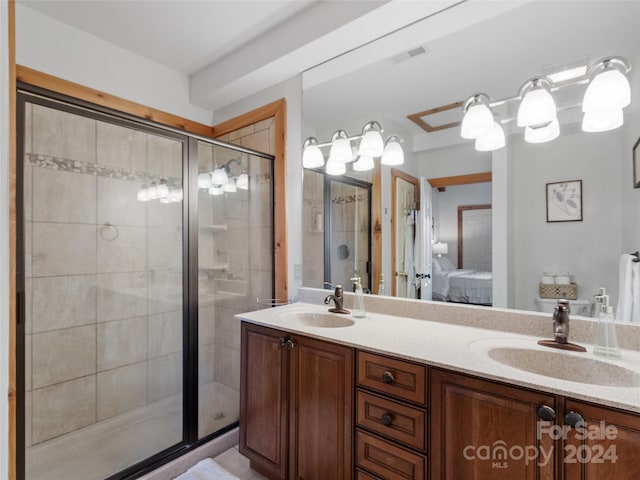 bathroom with vanity and an enclosed shower