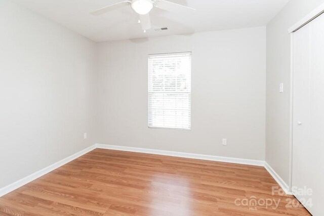 empty room featuring ceiling fan and wood-type flooring