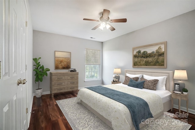 bedroom featuring ceiling fan and dark hardwood / wood-style floors