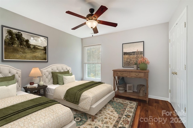 bedroom featuring dark wood-type flooring and ceiling fan