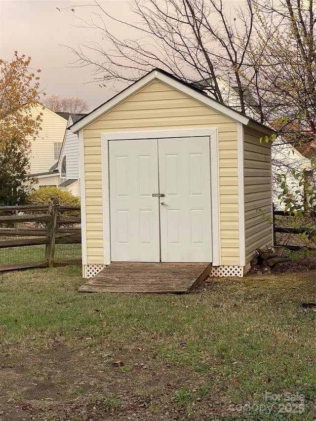 outdoor structure at dusk with a lawn