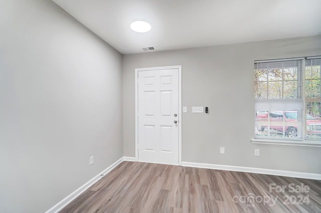 spare room with light hardwood / wood-style floors