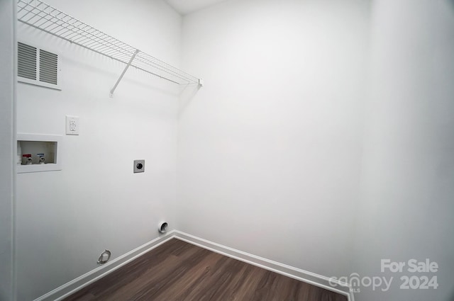 washroom with hookup for an electric dryer, washer hookup, and dark hardwood / wood-style floors