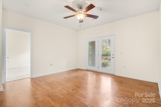 spare room featuring ceiling fan and light hardwood / wood-style floors