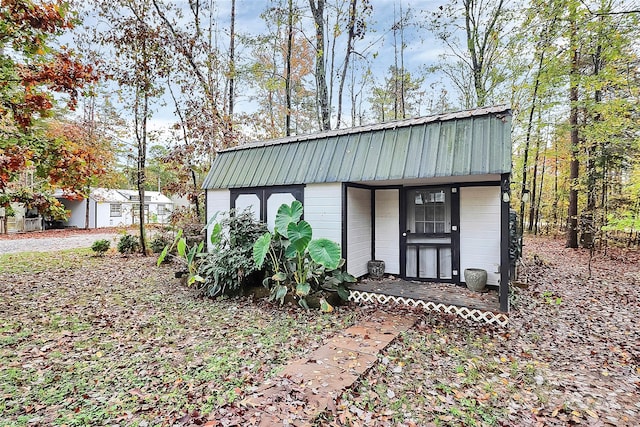 view of outbuilding with covered porch