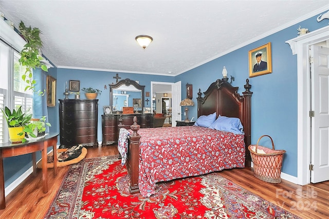 bedroom featuring wood-type flooring and ornamental molding