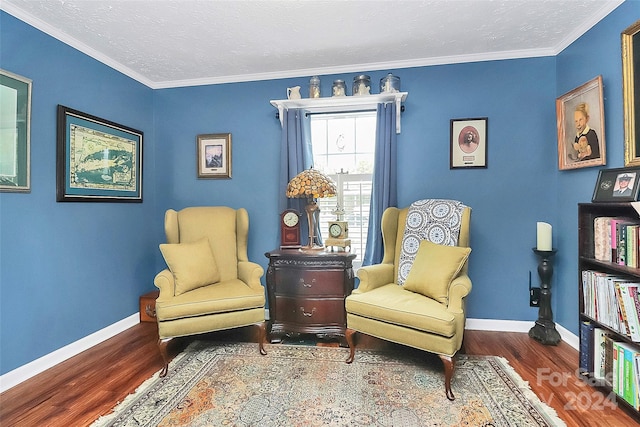 living area featuring ornamental molding and wood-type flooring