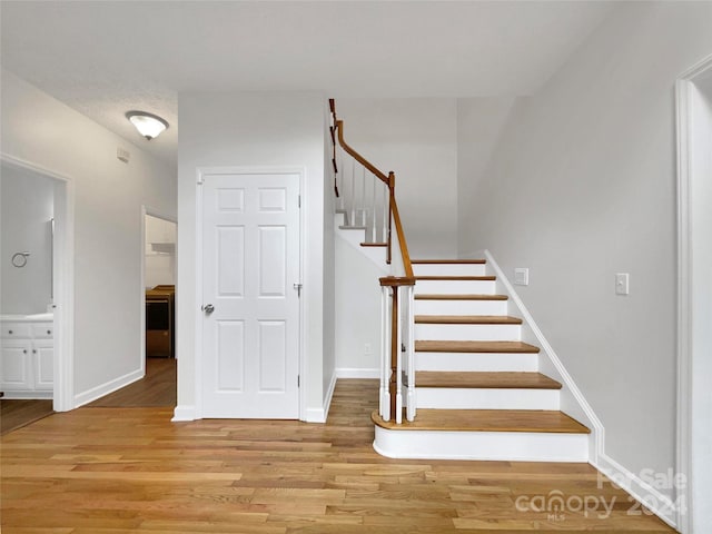 stairway with wood-type flooring