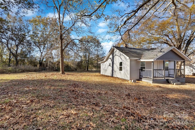 view of property exterior featuring covered porch