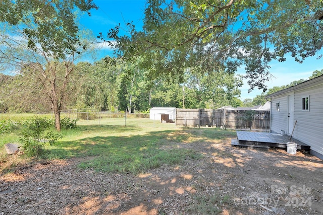 view of yard featuring a wooden deck