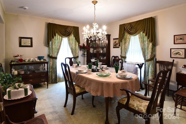 dining space featuring light colored carpet, ornamental molding, and a chandelier