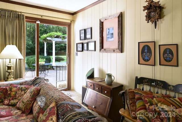 doorway to outside featuring crown molding