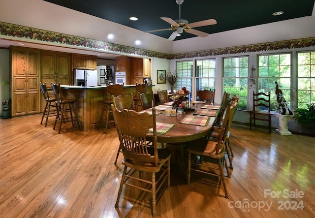 dining room featuring ceiling fan and light wood-type flooring