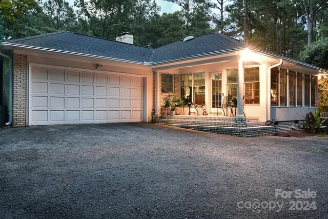 single story home featuring a garage