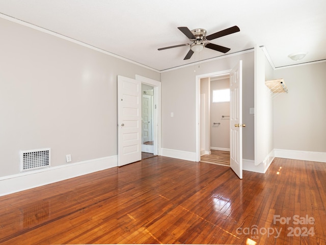 unfurnished room featuring crown molding, ceiling fan, and wood-type flooring