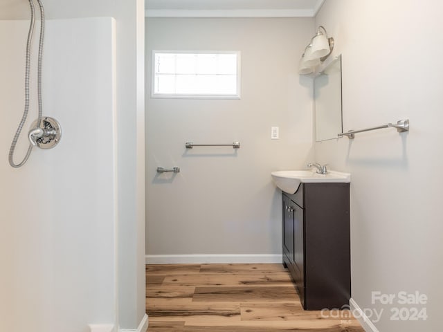 1411 Lineberger Ave, Gastonia, NC 28052 - bathroom featuring vanity, wood finished floors, a shower, baseboards, and crown molding