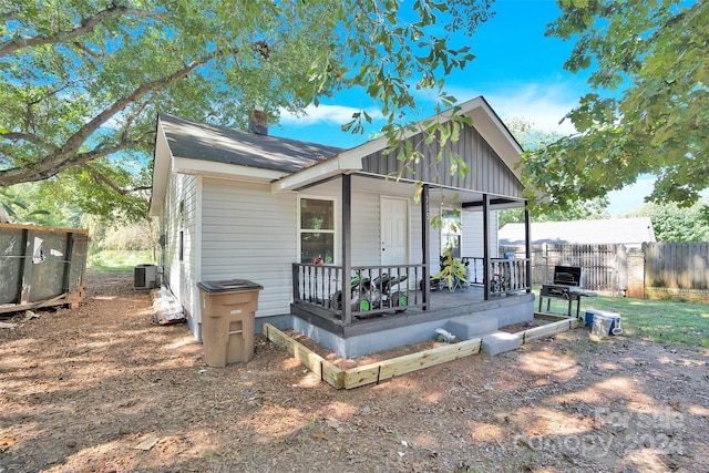 view of front of house with central air condition unit and a porch