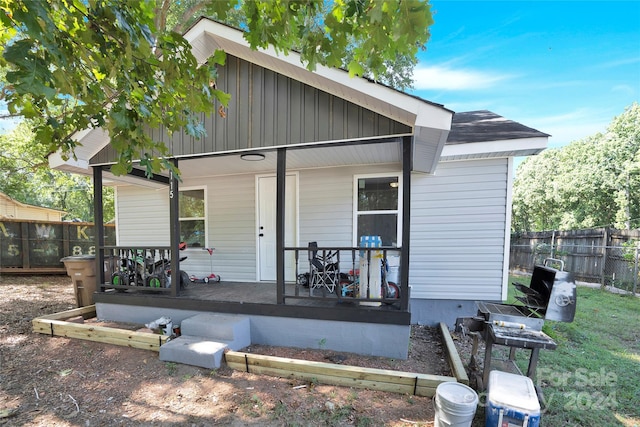 back of house with a porch