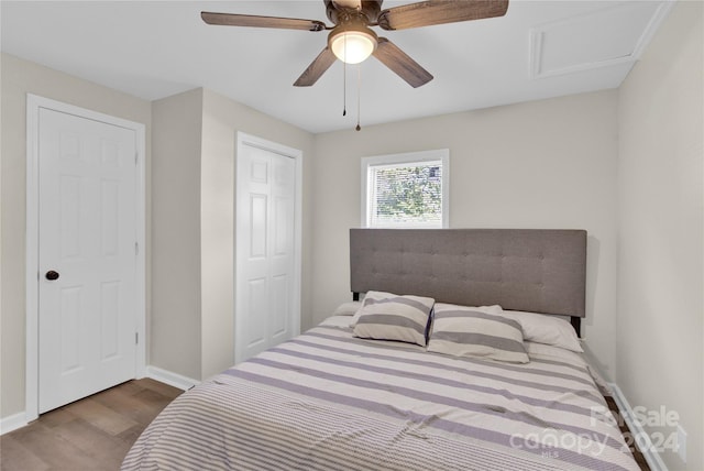 bedroom featuring wood-type flooring and ceiling fan