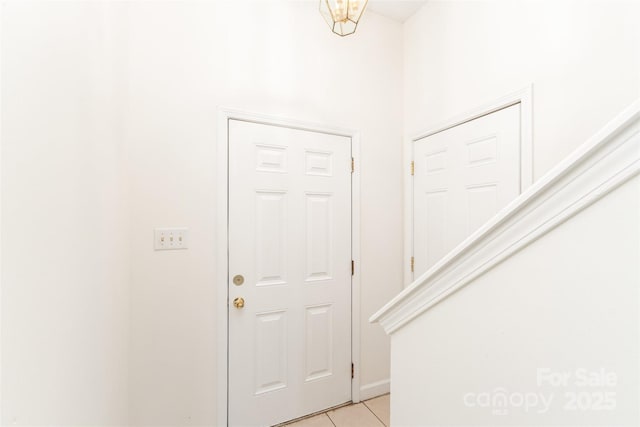 foyer entrance featuring light tile patterned floors